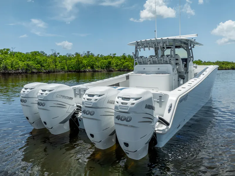Slide: The Image of 2019 Freeman 42 LR boat with quad 400 HP engines on calm water. - 5