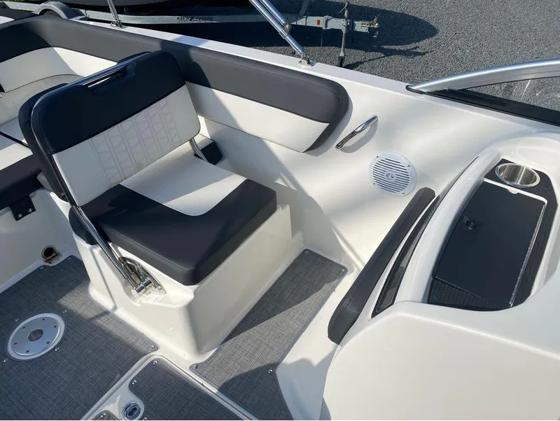 Slide: The Image of 2021 Bayliner VR6 Bowrider Outboard interior seating and deck area. - 11
