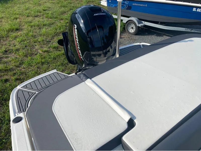 Slide: The Image of 2021 Bayliner VR6 Bowrider with Mercury outboard motor on trailer. - 5