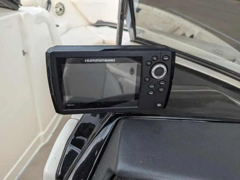Slide: The Image of Humminbird Helix 5 fish finder on a 2011 Monterey 264 FS boat dashboard. - 12