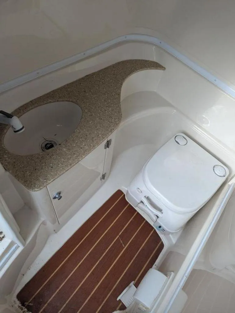 Slide: The Image of 2011 Monterey 264 FS boat bathroom with sink and toilet. - 14