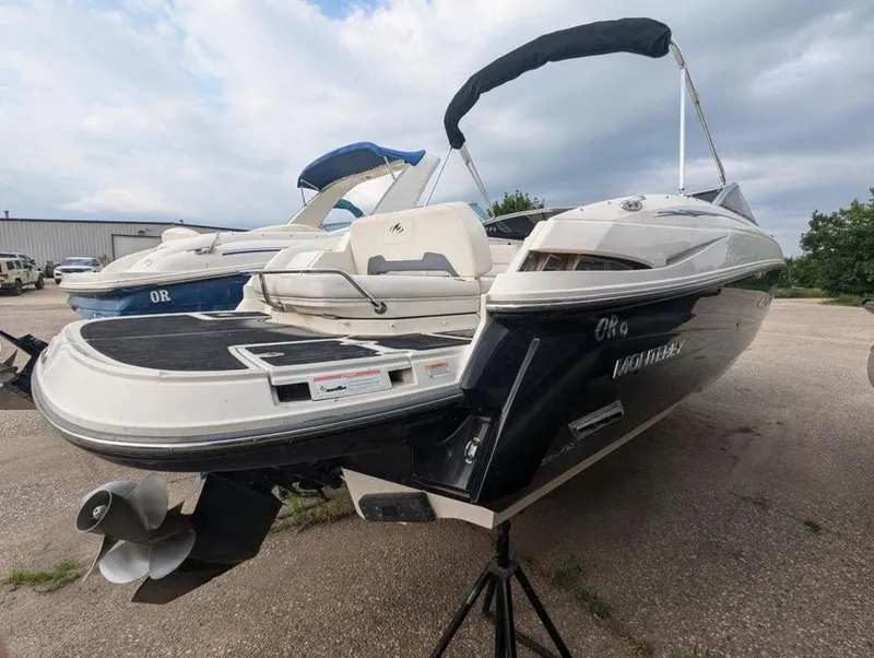 Slide: The Image of 2011 Monterey 264 FS boat in a parking lot, rear view. - 3