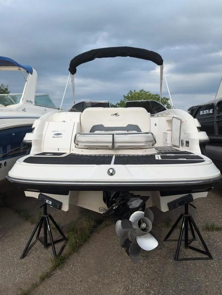 Slide: The Image of 2011 Monterey 264 FS boat with black canopy and dual propellers. - 4