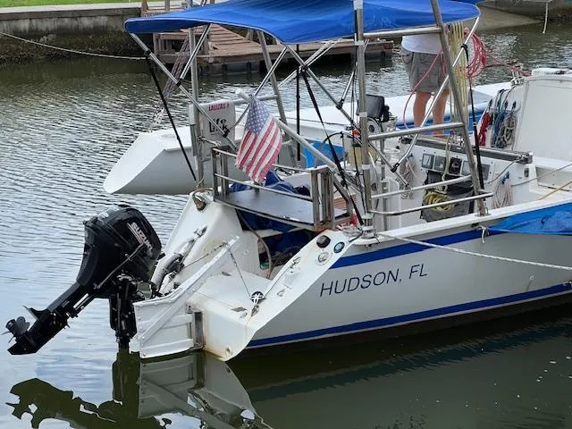 Slide: The Image of 1999 Contour 34 SC sailboat docked in Hudson, FL with American flag. - 1