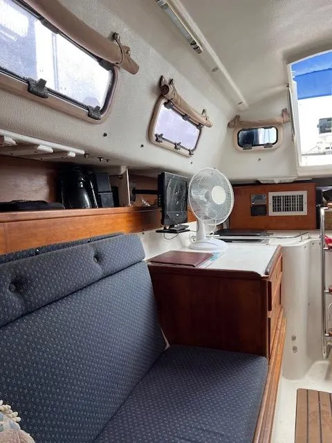 Slide: The Image of Interior of 1999 Contour 34 SC sailboat with seating and fan. - 15