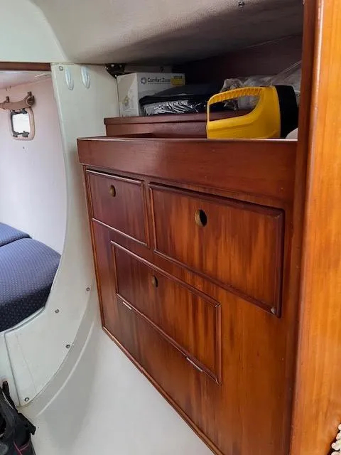 Slide: The Image of Wooden storage cabinet inside a 1999 Contour 34 SC sailboat. - 17