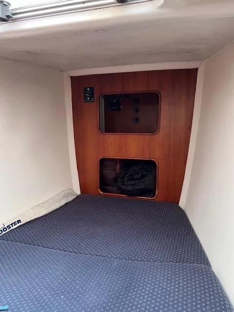 Slide: The Image of Interior cabin of a 1999 Contour 34 SC sailboat with wooden paneling. - 18