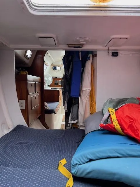 Slide: The Image of Interior of a 1999 Contour 34 SC sailboat with bedding and storage. - 20