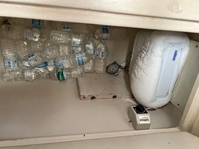 Slide: The Image of Frozen water bottles in a Contour 34 SC boat refrigerator, 1999 model. - 24