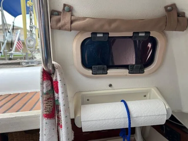Slide: The Image of Interior view of 1999 Contour 34 SC sailboat with window and paper towel holder. - 28