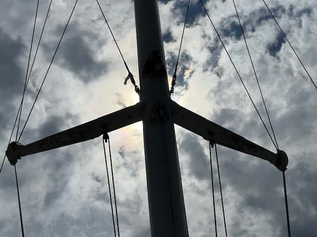 Slide: The Image of Silhouette of Contour 34 SC sailboat mast against cloudy sky, 1999 model. - 38