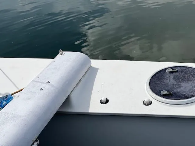 Slide: The Image of Close-up of a 1999 Contour 34 SC boat deck with water reflection. - 39