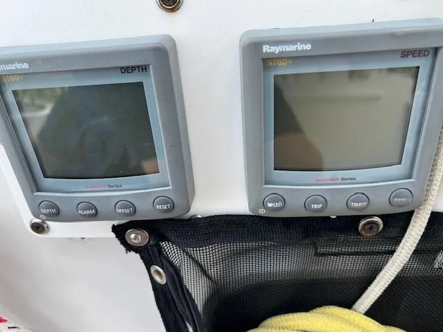 Slide: The Image of Depth and speed gauges on a 1999 Contour 34 SC boat. - 44