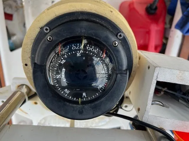 Slide: The Image of Close-up of a 1999 Contour 34 SC boat compass. - 45