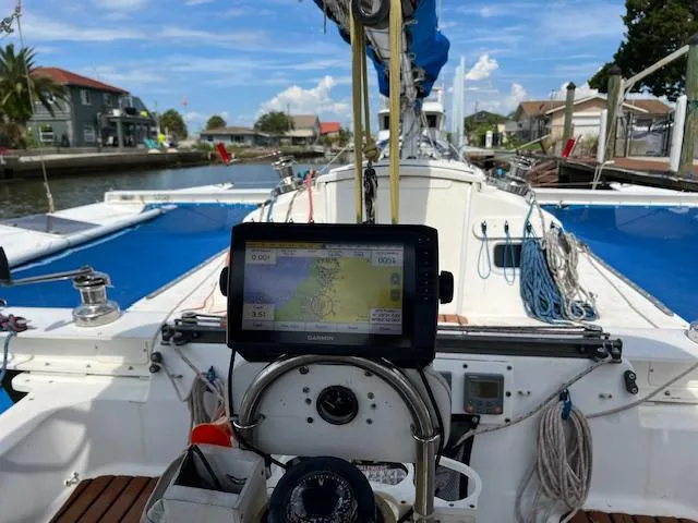 Slide: The Image of Cockpit view of a 1999 Contour 34 SC sailboat with navigation equipment. - 48