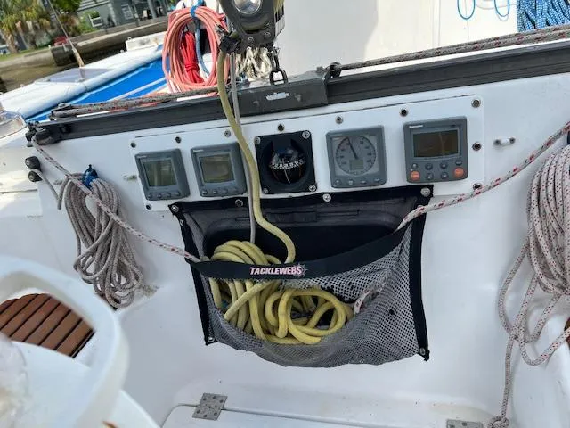 Slide: The Image of Control panel of a 1999 Contour 34 SC sailboat with ropes and gauges. - 49