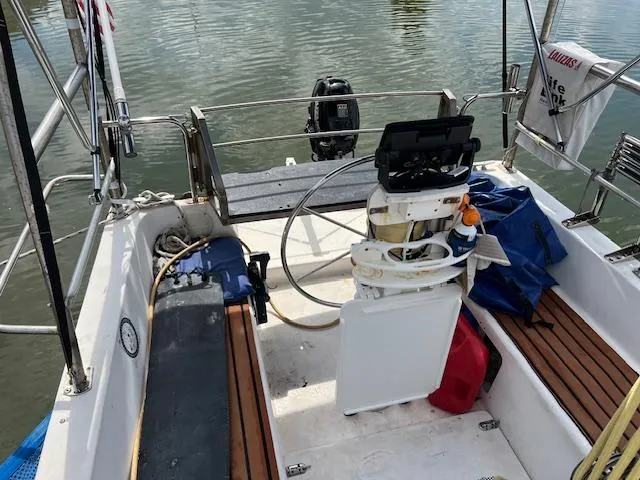 Slide: The Image of 1999 Contour 34 SC sailboat cockpit with steering wheel and seating. - 7