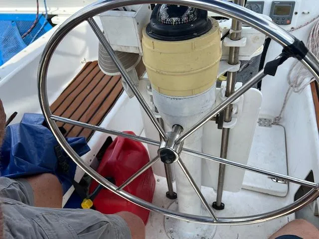 Slide: The Image of Steering wheel of a 1999 Contour 34 SC sailboat with navigation instruments. - 9