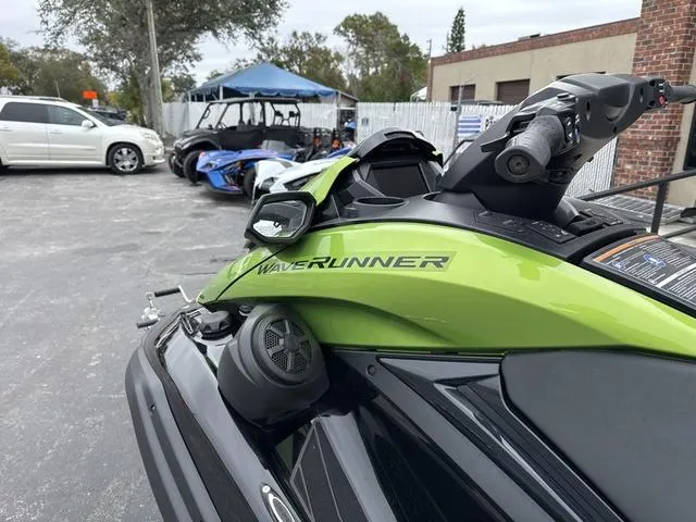 Slide: The Image of 2024 Yamaha Marine Waverunner FX Cruiser SVHO with audio, green and black, parked outdoors. - 6