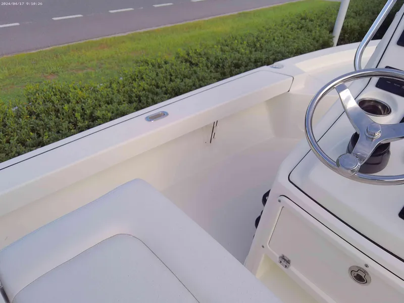 Slide: The Image of 2025 Pathfinder 2200 TRS boat interior with steering wheel and seating. - 11