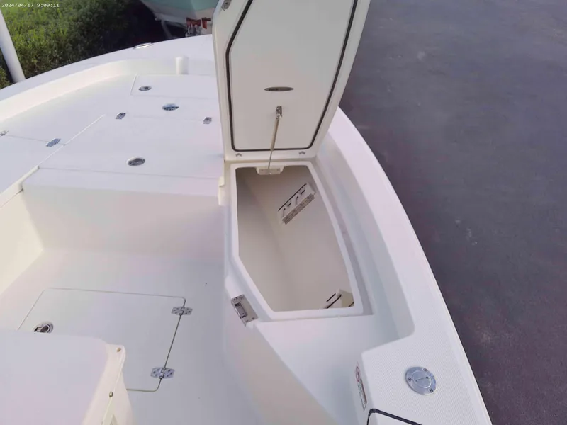 Slide: The Image of 2025 Pathfinder 2200 TRS boat with open storage compartment on deck. - 5