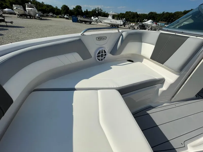 Slide: The Image of 2024 Chaparral 21 SSi OB boat interior with white and gray seating. - 10