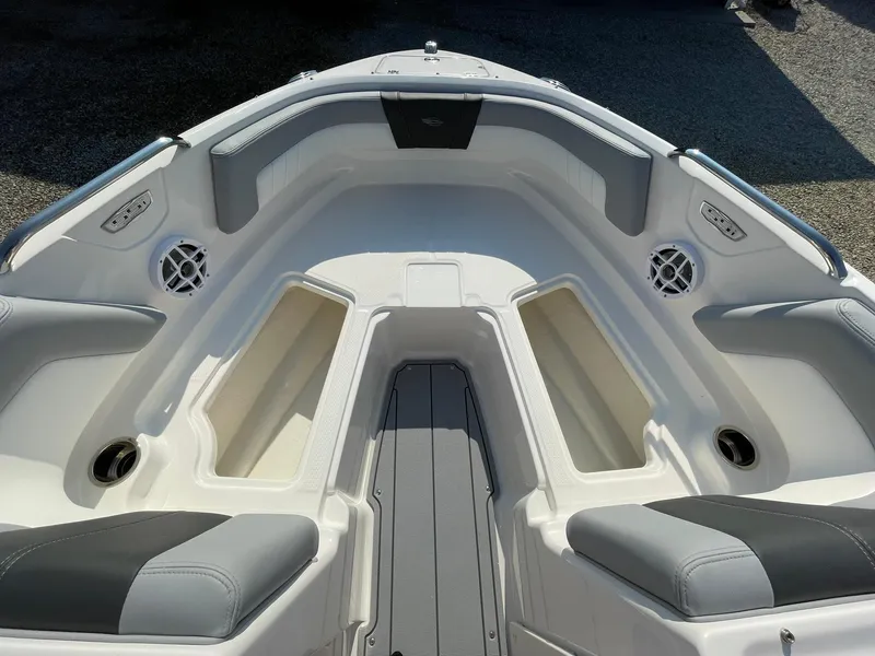 Slide: The Image of 2024 Chaparral 21 SSi OB boat interior with spacious seating and storage compartments. - 13