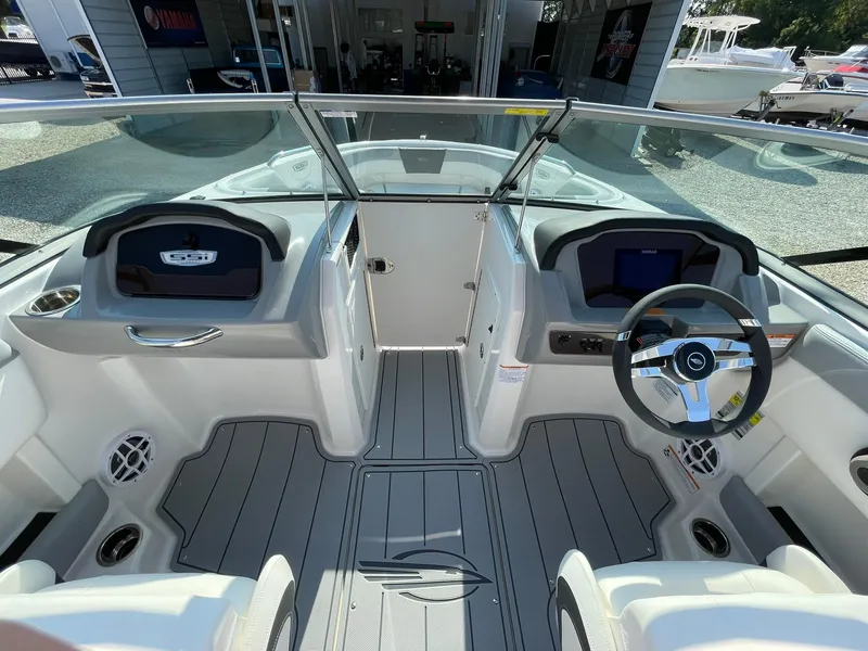 Slide: The Image of 2024 Chaparral 21 SSi OB boat interior with modern dashboard and steering wheel. - 15