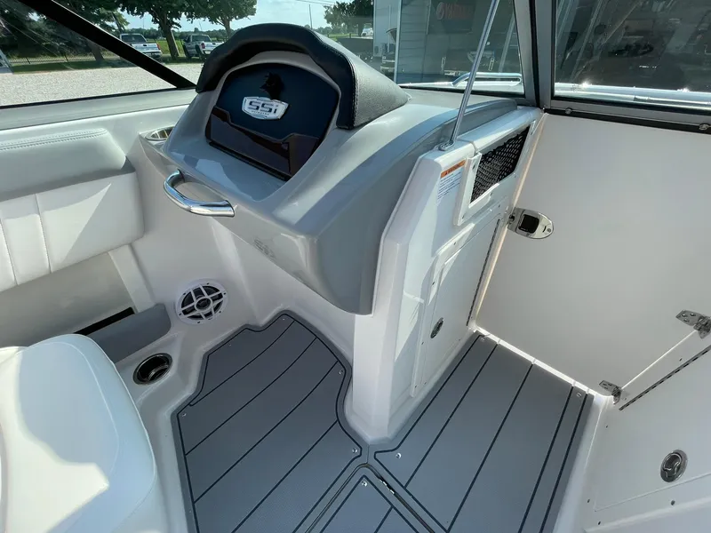 Slide: The Image of 2024 Chaparral 21 SSi OB boat interior with modern dashboard and seating. - 17