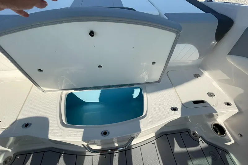 Slide: The Image of 2024 Chaparral 21 SSi OB boat storage compartment open. - 34