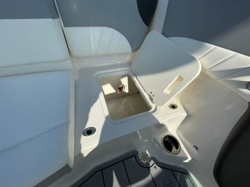 Slide: The Image of 2024 Chaparral 21 SSi OB boat storage compartment with open hatch. - 36