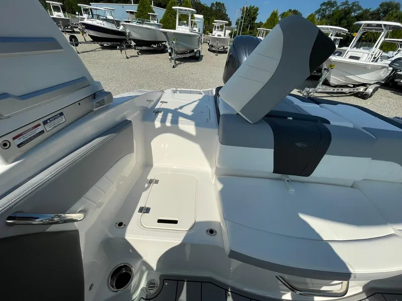 Slide: The Image of 2024 Chaparral 21 SSi OB boat interior with seating and storage compartments. - 38
