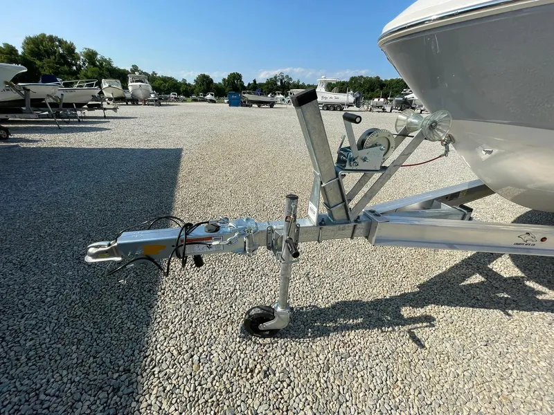 Slide: The Image of 2024 Chaparral 21 SSi OB boat trailer hitch on gravel lot. - 4