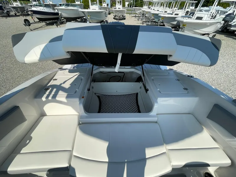 Slide: The Image of 2024 Chaparral 21 SSi OB boat interior with open storage compartment. - 43