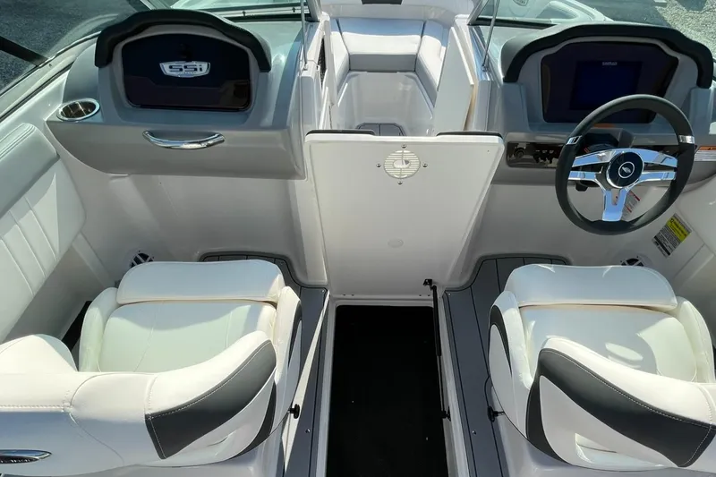 Slide: The Image of Interior of 2024 Chaparral 21 SSi OB boat with white seating and modern dashboard. - 47