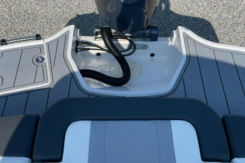 Slide: The Image of 2024 Chaparral 21 SSi OB boat stern with outboard motor. - 49