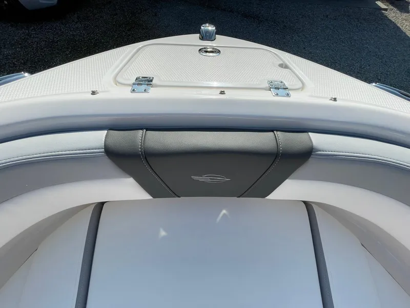 Slide: The Image of 2024 Chaparral 21 SSi OB boat bow seating and storage compartment. - 7