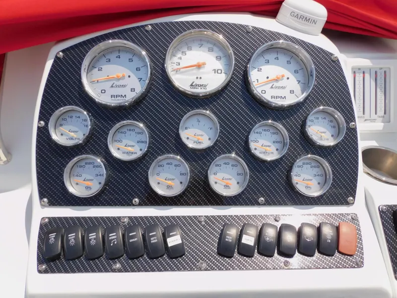 Slide: The Image of Dashboard of a 2007 Baja Outlaw 35 boat with Livorsi gauges and switches. - 44