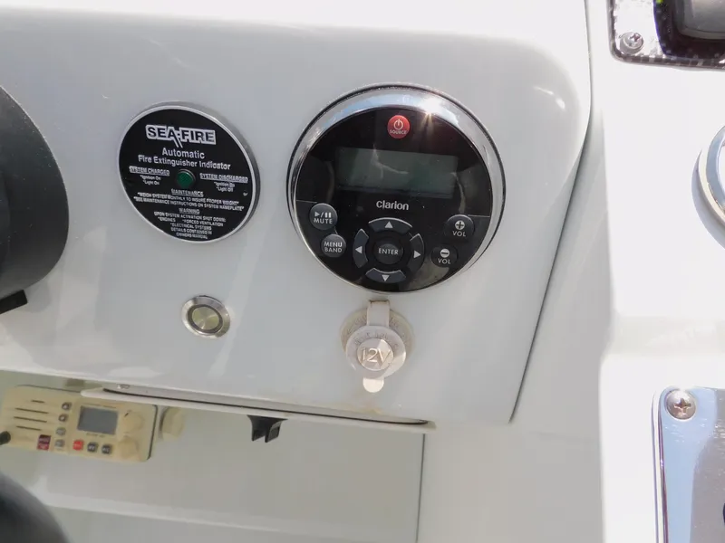 Slide: The Image of 2007 Baja Outlaw 35 dashboard with Sea-Fire extinguisher indicator and Clarion audio controls. - 47
