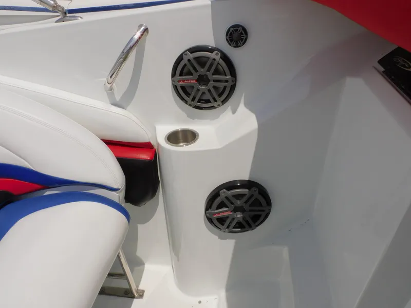 Slide: The Image of Interior of a 2007 Baja Outlaw 35 boat with speakers and cup holder. - 52