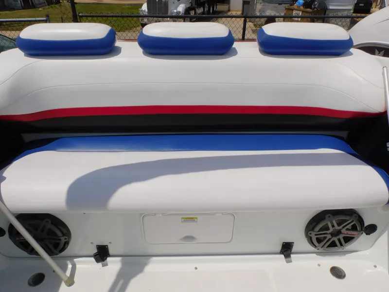 Slide: The Image of 2007 Baja Outlaw 35 boat interior seating with blue, white, and red accents. - 53