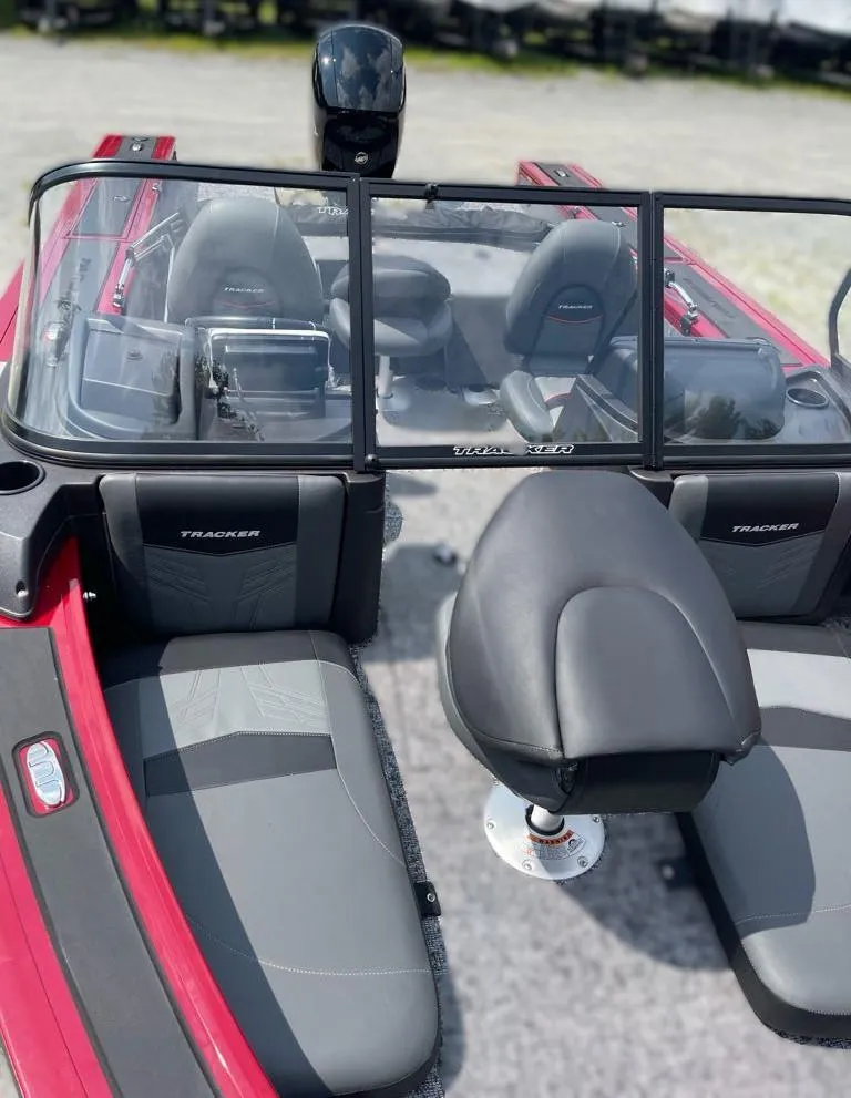 Slide: The Image of 2024 Tracker Targa V-18 Combo boat interior with seating and console view. - 3