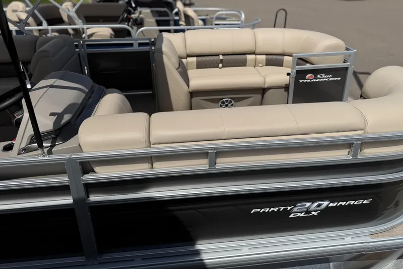 The Image of 2024 Sun Tracker Party Barge 20 DLX pontoon boat with beige seating and sleek design. - 0