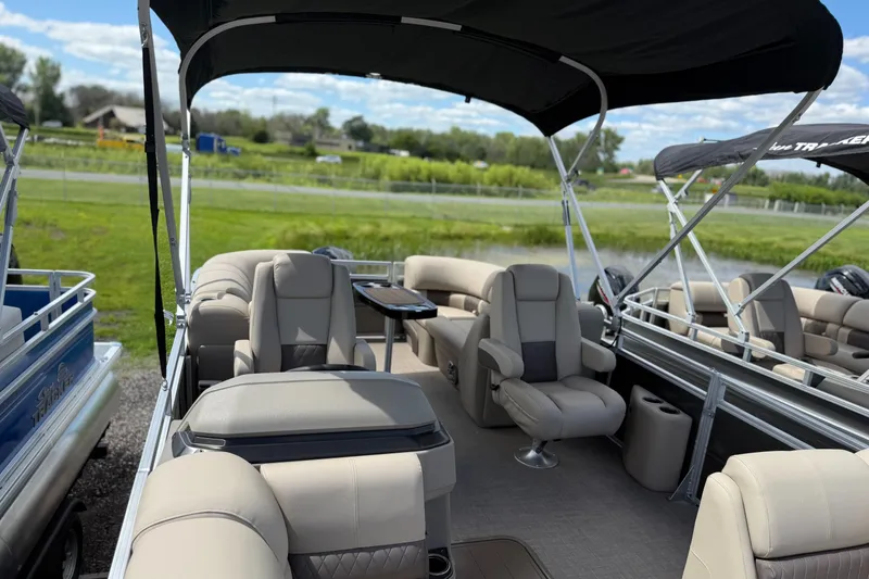 Slide: The Image of 2024 Sun Tracker Party Barge 20 DLX pontoon boat with spacious seating and canopy. - 2