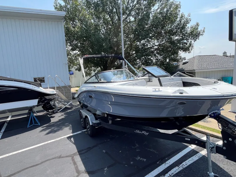 Slide: The Image of 2025 Sea Ray SPX 190 boat on a trailer in a parking lot. - 4
