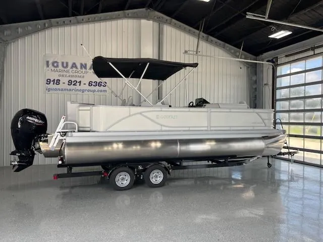The Image of 2025 Godfrey Sweetwater 2286 F pontoon boat on trailer in showroom. - 1