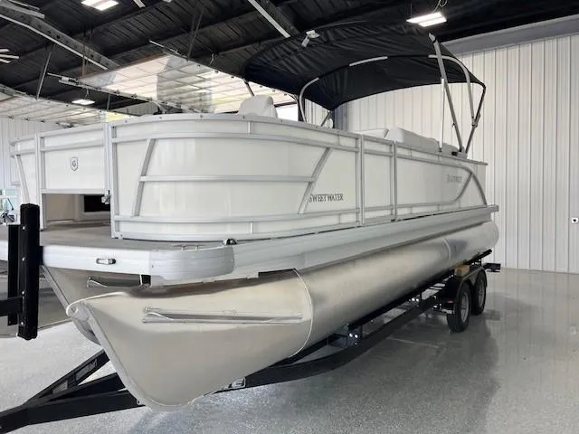 Slide: The Image of 2025 Godfrey Sweetwater 2286 F pontoon boat on trailer in showroom. - 4