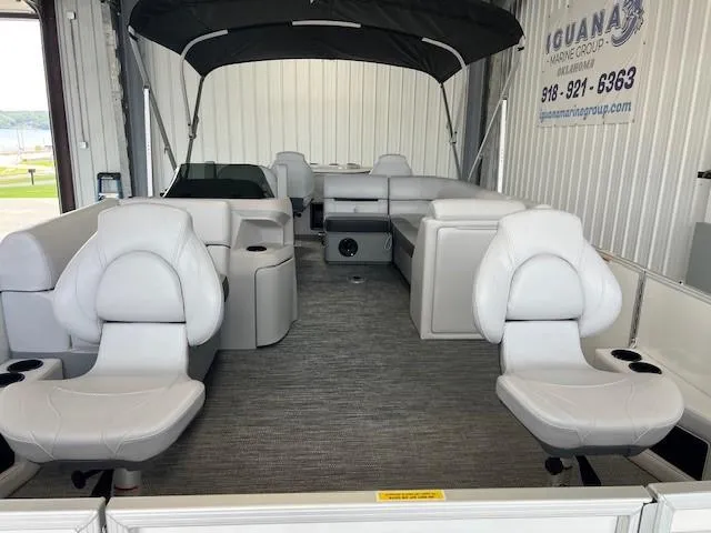 Slide: The Image of 2025 Godfrey Sweetwater 2286 F pontoon boat interior with seating and canopy. - 6