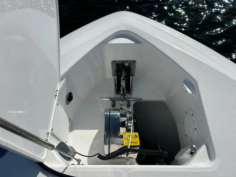 Slide: The Image of Anchor compartment of 2019 Everglades 340DC boat with open hatch. - 19