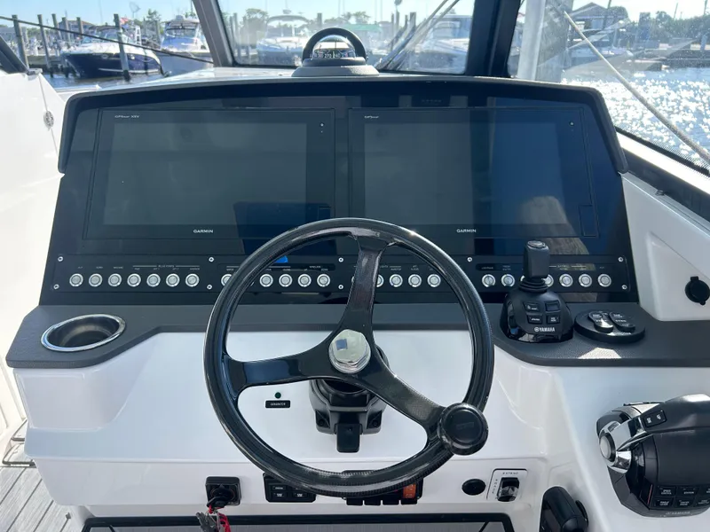 Slide: The Image of 2019 Everglades 340DC helm with dual displays and steering wheel. - 7